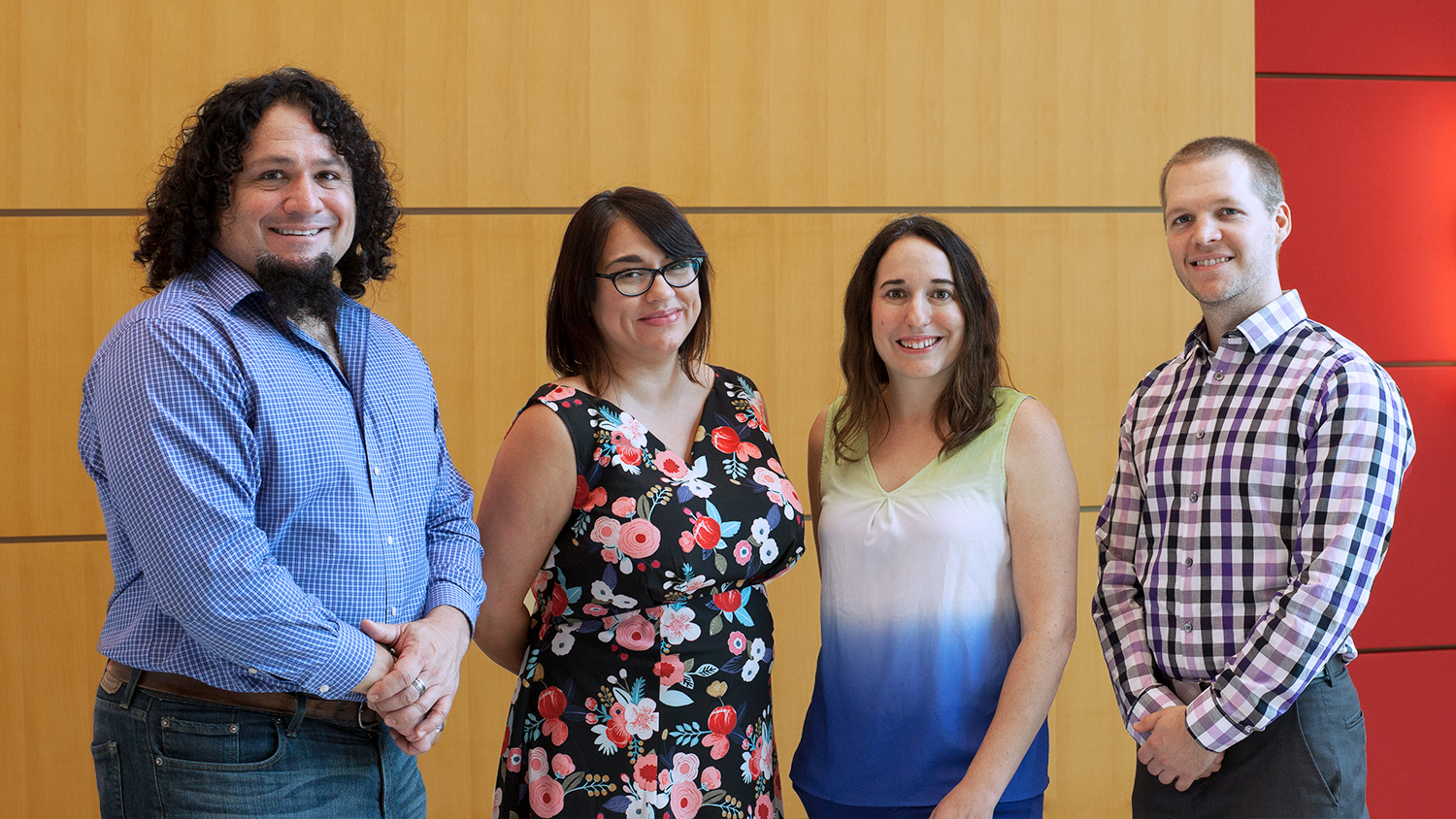 Image of DELTA 2018-2019 DELTA Faculty Fellows in the CTI lobby. Standing left to right: James McConnell, Melissa Ramirez, Stacy Supak, and Justin Post.