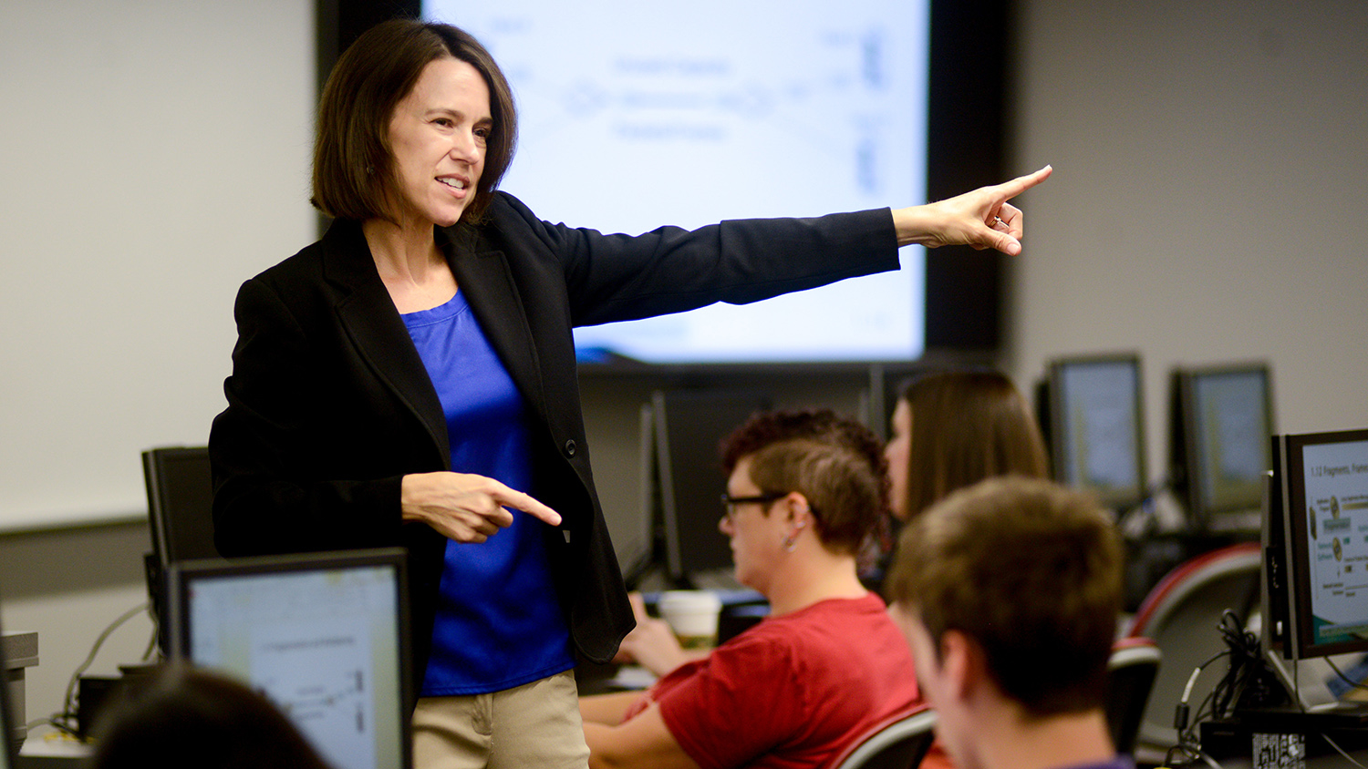 teacher speaking with students