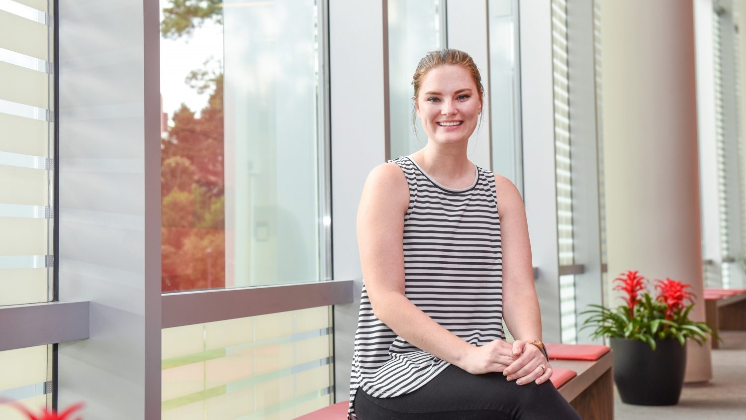 Kalysha Clark sits in front of a window