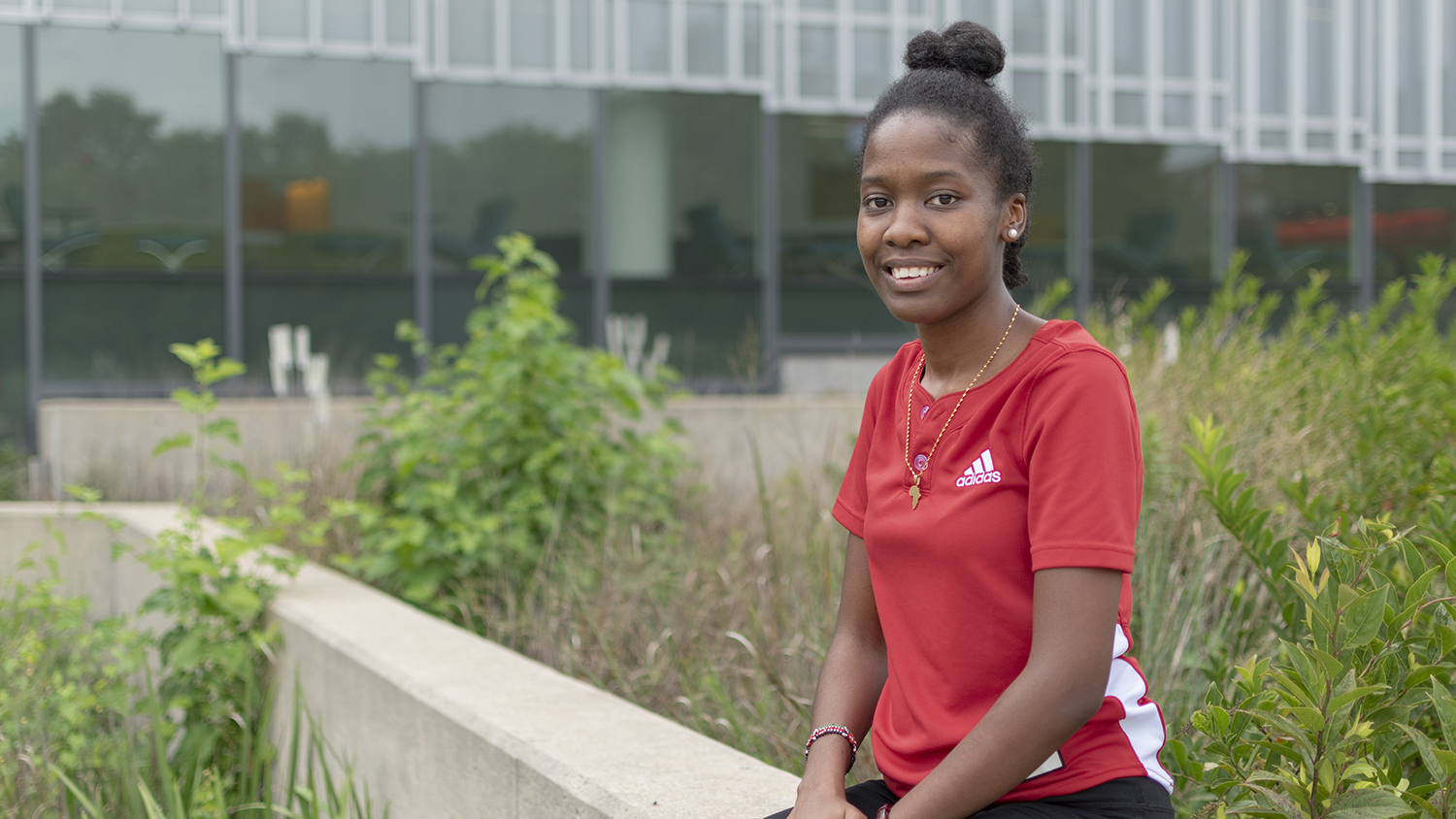 Photograph of Goodnight Scholar Ednah Sangaka from the transfer class of 2022 in front of Hunt Library on NC State Centennial Campus.