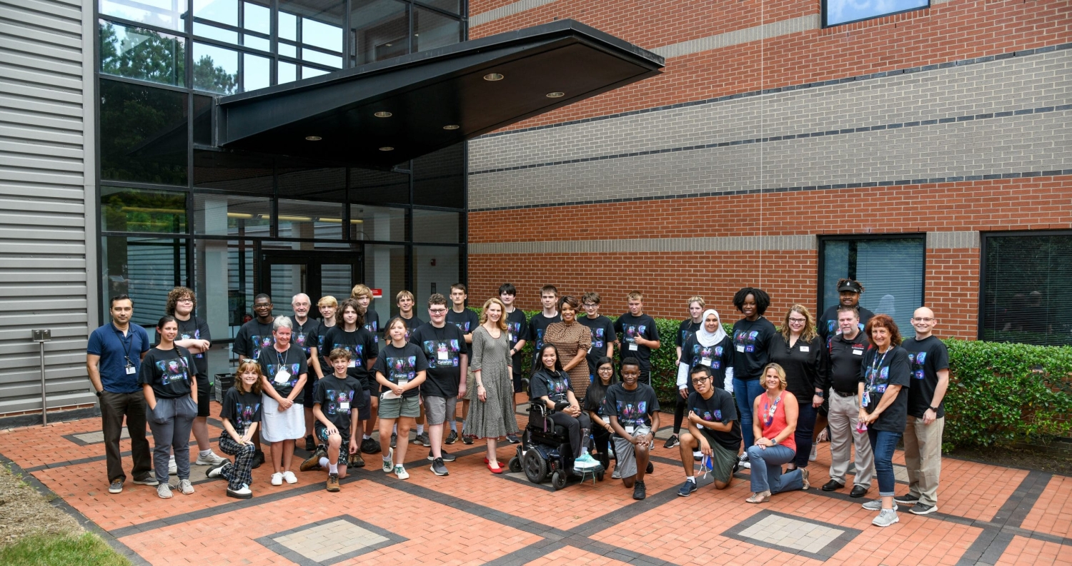 group of people standing in front of a building