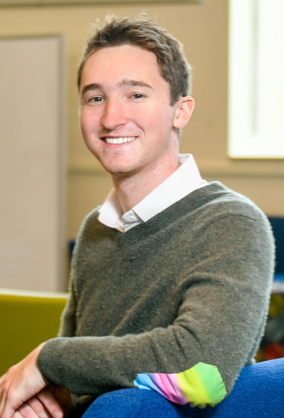 Jack Featherstone wearing a green sweater