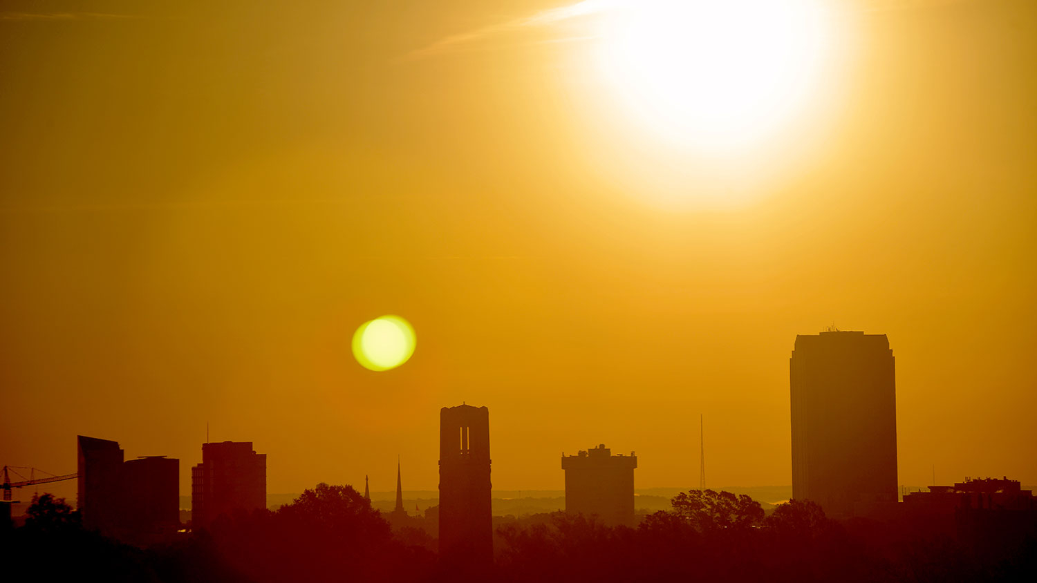 The sun over NC State's campus