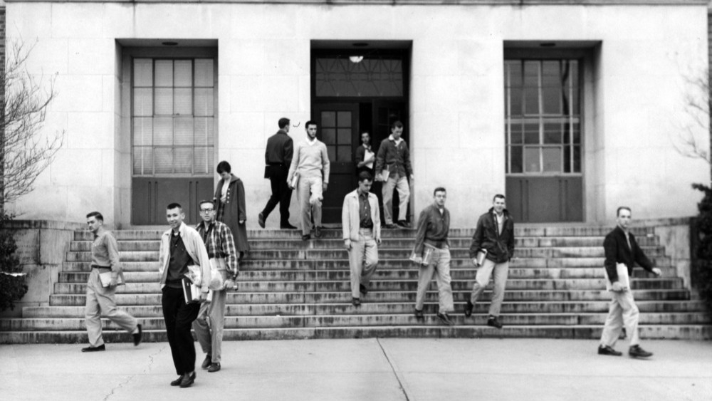 Black and white photo of students leaving Withers Hall circa 1950-1959